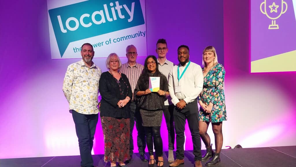 WECIL team smiling with Locality award